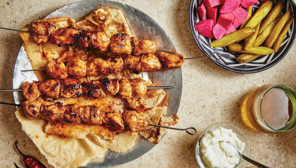 Chicken Kabab (Tawook) · Two skewers breast chicken. Served with rice, hummus and salad.
