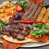 Mixed Grill (Mkshakkal) · Six skewers mshakkal. A tempting array of shish kabob, kafta kabob and chicken kabob grilled...