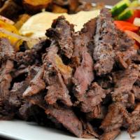 Lamb Shawarma Plate · Lamb fillet sliced, marinated with vinegar and Eastern spices. Served with hummus, rice and ...