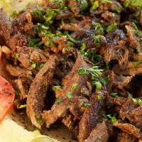 Beef Shawarma · Beef slices marinated with vinegar and Eastern spices. Served with hummus and salad or rice.