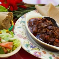 Awaze Beef Tibes (Mild Or Spicy) · Cubed tender beef marinated and cooked with garlic, tomato, and berbere sauce