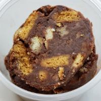 Chocolate Salame · Homemade dessert made with dark chocolate, broken biscuits, butter, sugar, eggs rolled, and ...