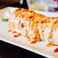 Spicy Baked Salmon Roll · Spicy crab meat and avocado inside; baked salmon, spicy creamy and eel sauce on top.