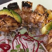 Dragon Roll · Tempura shrimp, crab meat, avocado inside; fresh water eel, avocado, and eel sauce on top.
