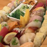  Kumiko Boat · Assorted nigiri (eight pieces), assorted sashimi (eight pieces), rainbow roll, crunch roll, ...