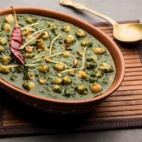 Chana Palak · Delicious garbanzo beans and spinach cooked with herbs and spices.