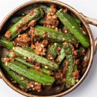 Bhindi Masala · Fresh okra cooked with chopped onions, tomatoes, and spices.