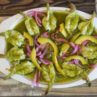 Aguachiles · Shrimp sauteed on spicy sauce and lime juice, served with chopped cucumber, red onion, jalap...