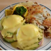 Brent’S Special Benedict · Two poached eggs and Canadian bacon on a grilled English muffin topped with avocado and holl...