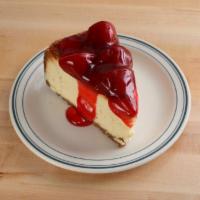 Strawberry-Topped New York Cheesecake · A cut of our traditional rich and creamy New York style cheesecake with a crumbling graham c...