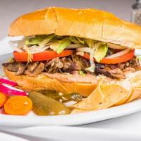 Carnitas Torta · Roasted pork. Authentic Mexican style grilled sandwich made with beans, mayonnaise, lettuce,...