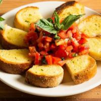 Bruschetta · Chopped tomatoes with garlic and basil, marinated in extra virgin olive oil and balsamic. Se...