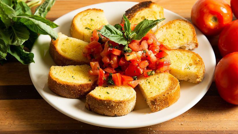 Bruschetta · Chopped tomatoes with garlic and basil, marinated in extra virgin olive oil and balsamic. Served on toasted garlic bread.