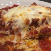 Lasagna Ala Forno · Lasagna Noodles layered with Ricotta Cheese, Imported Parmesan, Mozzarella, Fresh Herbs and ...