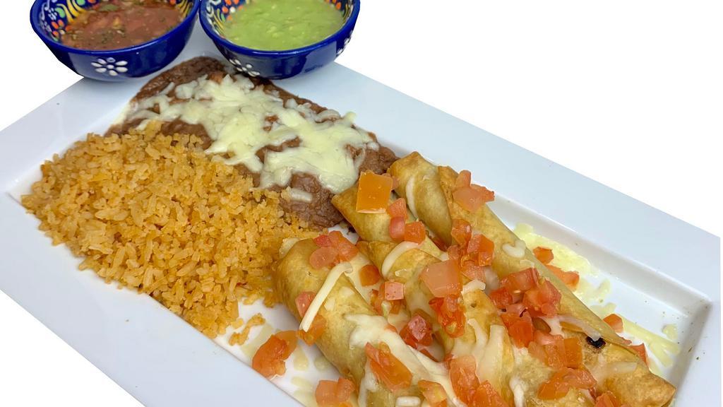 Flautas Dinner · Flour tortillas filled with seasoned chicken, rolled, fried till golden brown. Garnished with cheese and diced tomatoes. Served with rice and beans. Salsa and guacamole on the side.