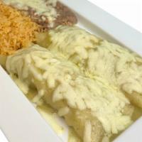 Enchilada Suizas Dinner · 2 corn tortillas stuffed with seasoned chicken and smothered with green tomatillo sauce topp...