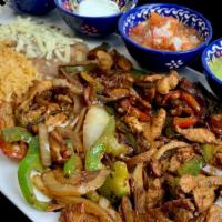 Fajitas Special Dinner · Seasoned and grilled with sautéed onions and bell peppers with guacamole, sour cream, and pi...