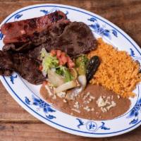 Carne Asada · Tender slices of sirloin, grilled with onions in the traditional way. Served with tortillas.
