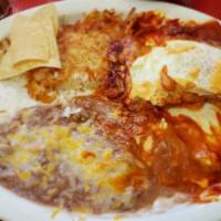 Huevos A Caballo(Red Or Green) · Two eggs any style on top of two red cheese enchiladas.