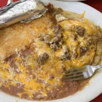 Huevos Rancheros · Two eggs any style. Topped with pork chile verde over a corn tortilla.