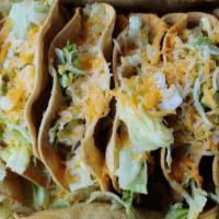 Crispy Taco · Shredded chicken or shredded beef with lettuce and cheese.