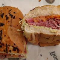 The Fa Sandwich · Corned beef, pastrami, cheddar cheese, lettuce, onion ,tomato and thousand island on an onio...