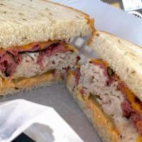 Rancho Overload Sandwich · Double meat. Steamed turkey and pastrami, cheddar cheese, pickle, tomato, Dijon and 1000 Isl...