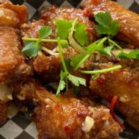 Honey Garlic Wings / Canh Ga Chien Gion · Spicy. Crispy chicken wings tossed with honey garlic sauce.
