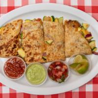 Veggie Quesadilla (1) · Flour tortilla with melted cheese and grilled veggies (bell pepper, zuchinnis and onions)
