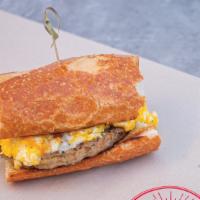 Sausage And Egg Sandwich · Pork sausage patty served with cheesy scrambled eggs & a sprinkle of cheddar.