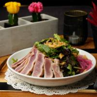 Yellowfin Tuna Salad · Pan seared with brown rice, mixed greens, avocado, pickled red onions, crispy onions, sesame...