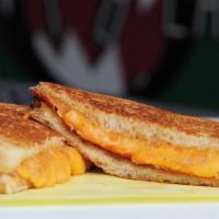 Grilled Cheese · Melted Monterrey Jack and cheddar cheese sandwiched between 2 slices of toasted sourdough.