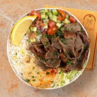 Beef And Lamb Gyro Rice Bowl · Marinated beef and lamb over basmati rice with hummus, diced cucumber and tomato salad, shre...