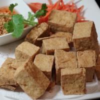 Fried Tofu · Served with sweet chili sauce topped with crushed peanuts.