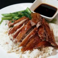 Roasted Duck Over Rice · With stir fried watercress.