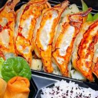 Yaki Chicken Gyoza Bento · 6pcs of Pan Fried Chicken Gyoza with Rice, Spaghetti, Vegetables, Spring Roll, and Pickles. ...