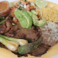 Carne Asada Entera  (Whole ) · Two grilled pieces of chuck roll steak, includes rice, beans, grill onions, lettuce, tomato ...