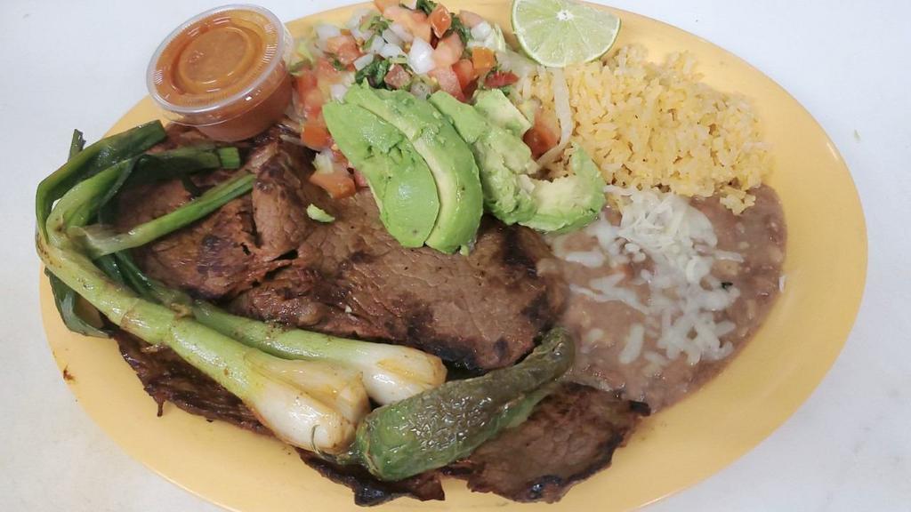 Carne Asada Entera  (Whole ) · Two grilled pieces of chuck roll steak, includes rice, beans, grill onions, lettuce, tomato and 6 tortillas.