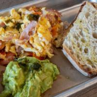 Estate Scramble · Toasted sourdough country loaf topped with avocado mash and two eggs scrambled with cheddar ...