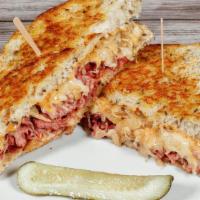 Reuben · Thinly sliced corned beef on Rye with sauerkraut, thousand islands, and Swiss cheese.