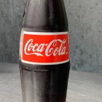 Mexican Coke · Mexican Coke-Made with pure cane sugar, no high fructose corn syrup, in a glass bottle 355 ml