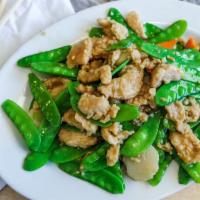 Chicken With Snow Peas · Chicken stir-fried with snow peas. Served with white rice.