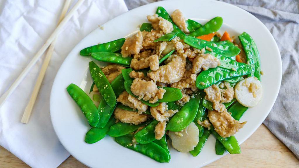 Chicken With Snow Peas · Chicken stir-fried with snow peas. Served with white rice.