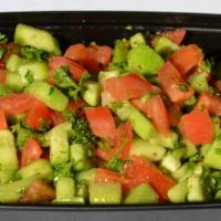 Shirazi Salad · Chopped cucumbers, tomatoes and green onions with fine herbs and lemon juice dressing.