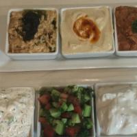 Appetizer Combo Platter · A selection of appetizers, including hummus, mast o moosir, mast o khiar, shirazi salad, Mir...