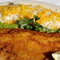 Trout · A fresh filet of trout either fried or broiled and served with white rice and salad.