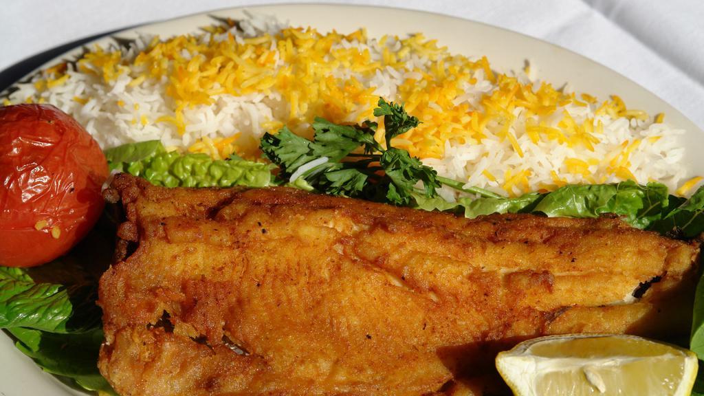 Trout · A fresh filet of trout either fried or broiled and served with white rice and salad.