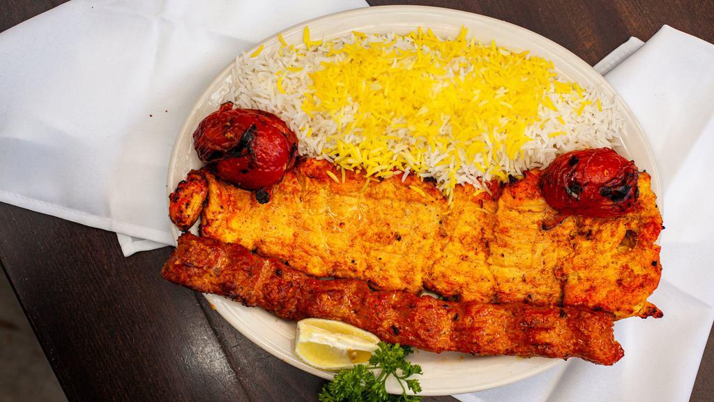 Chicken Soltani · A combination of the barg chicken kabob and koobideh chicken kabob. Served with fluffy rice and tomato.
