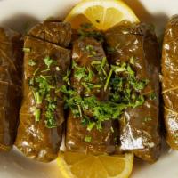 Grape Leaves · Six grape leaves stuffed with rice and herbs and cooked in lemon juice.