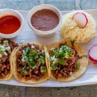 Taco Plate · 3 street tacos. Served with onion, cilantro, rice and beans.